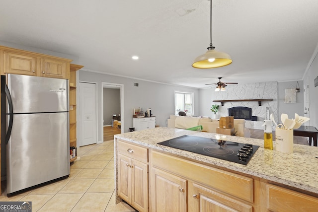 631 Valleybrook Rd, Savannah, GA 31419 - kitchen with freestanding refrigerator, black electric stovetop, light brown cabinets, ornamental molding, and a large fireplace