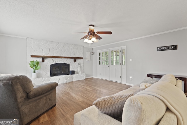 631 Valleybrook Rd, Savannah, GA 31419 - living area featuring wood finished floors, a ceiling fan, crown molding, and a stone fireplace