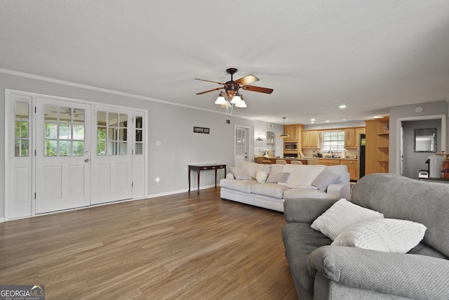 631 Valleybrook Rd, Savannah, GA 31419 - living room featuring light wood-style flooring, a ceiling fan, crown molding, and recessed lighting