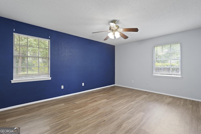 631 Valleybrook Rd, Savannah, GA 31419 - spare room with healthy amount of natural light, wood finished floors, ceiling fan, and a textured ceiling
