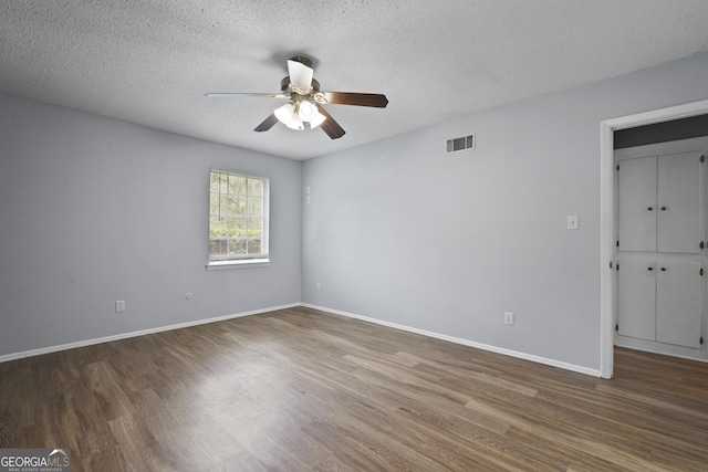 631 Valleybrook Rd, Savannah, GA 31419 - spare room featuring wood finished floors, ceiling fan, and a textured ceiling