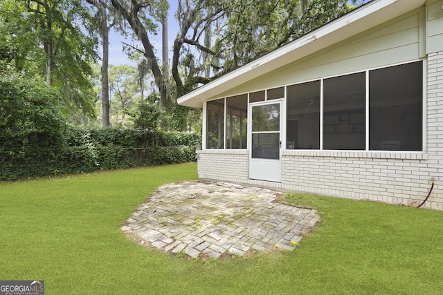 631 Valleybrook Rd, Savannah, GA 31419 - view of green lawn featuring a patio area and a sunroom