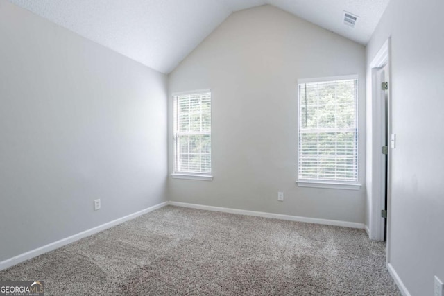 6207 Idlewood Cir, Lithonia, GA 30038 - carpeted empty room featuring lofted ceiling and plenty of natural light