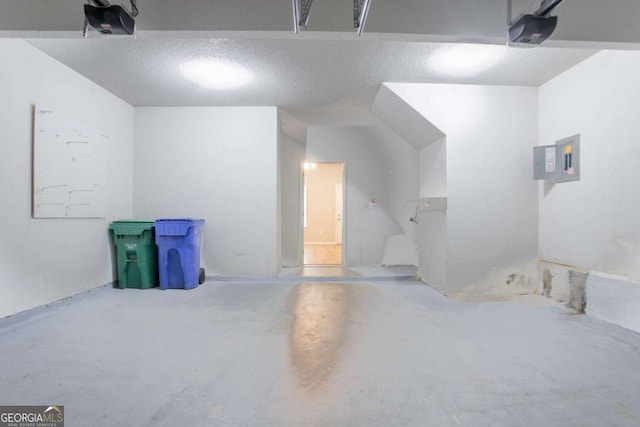 6207 Idlewood Cir, Lithonia, GA 30038 - garage featuring a garage door opener and electric panel