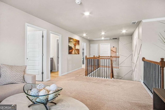 1049 Bodega Loop, Locust Grove, GA 30248 - sitting room with an upstairs landing, carpet flooring, and recessed lighting
