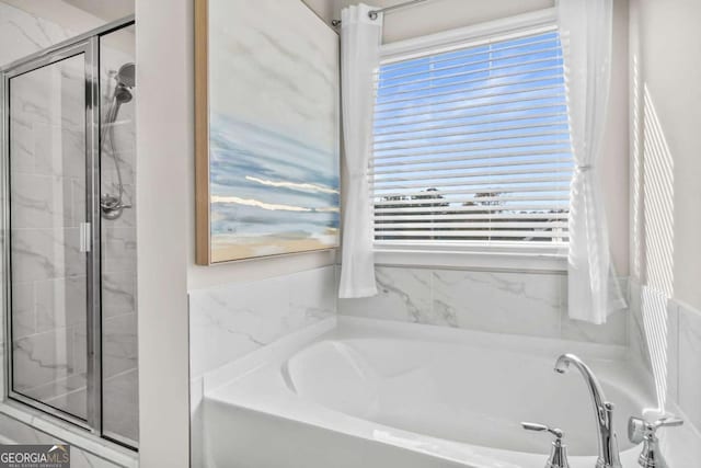 1049 Bodega Loop, Locust Grove, GA 30248 - full bath featuring a garden tub, a shower stall, and healthy amount of natural light
