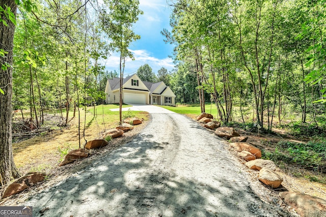 148 David Elder Rd, Griffin, GA 30223 - view of front facade with gravel driveway, a garage, and a front yard