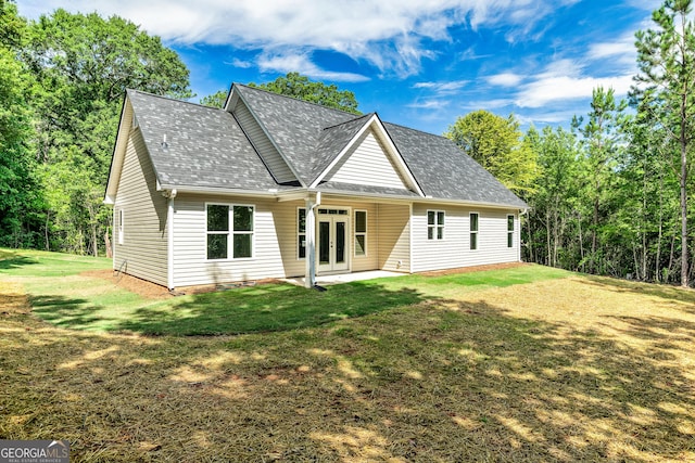 148 David Elder Rd, Griffin, GA 30223 - view of front facade featuring french doors, a front yard, and roof with shingles