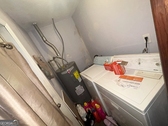 1551 Vaughn Rd, Griffin, GA 30223 - laundry room featuring washing machine and dryer and electric water heater