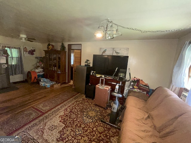 1551 Vaughn Rd, Griffin, GA 30223 - living room with a chandelier, ceiling fan, plenty of natural light, and wood finished floors