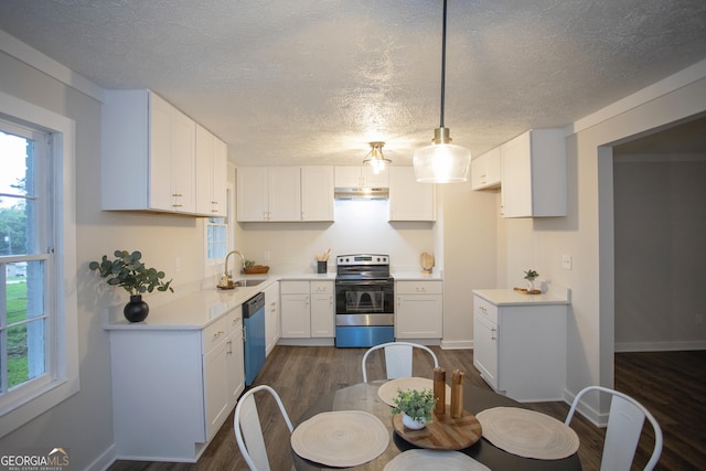 235 Cindy St, Jackson, GA 30233 - kitchen with electric stove, under cabinet range hood, dishwasher, dark wood-type flooring, and a textured ceiling