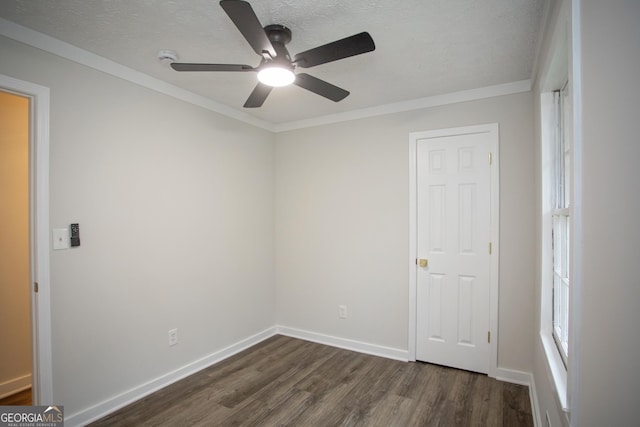 235 Cindy St, Jackson, GA 30233 - spare room featuring dark wood-type flooring, ceiling fan, a textured ceiling, and crown molding