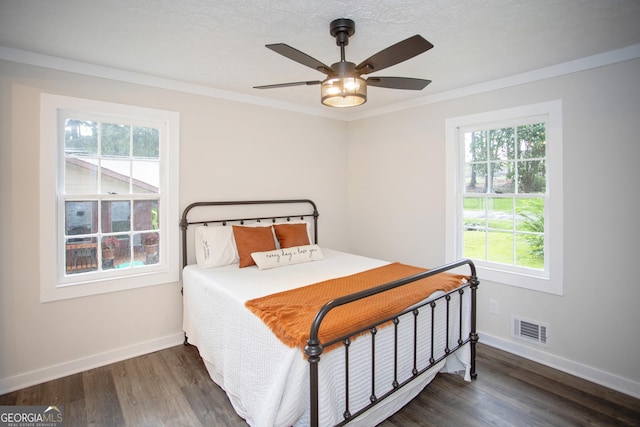 235 Cindy St, Jackson, GA 30233 - bedroom with multiple windows, wood finished floors, crown molding, and a ceiling fan