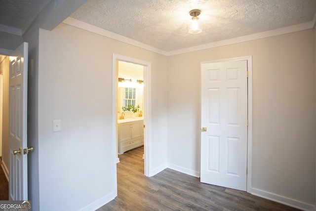 235 Cindy St, Jackson, GA 30233 - unfurnished bedroom featuring a textured ceiling and dark wood-style floors