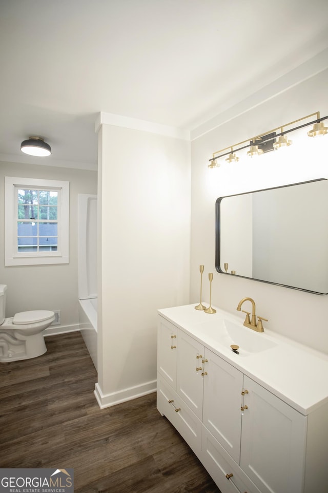 235 Cindy St, Jackson, GA 30233 - bathroom with vanity, wood finished floors, tub / shower combination, and ornamental molding