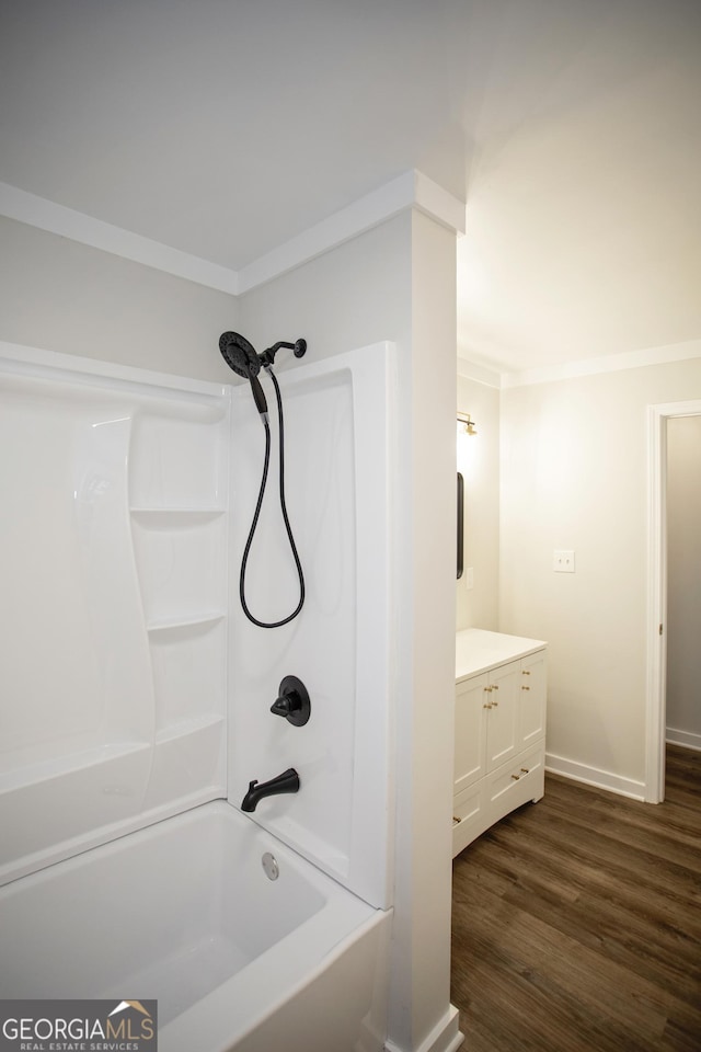 235 Cindy St, Jackson, GA 30233 - full bathroom with vanity, wood finished floors,  shower combination, and crown molding
