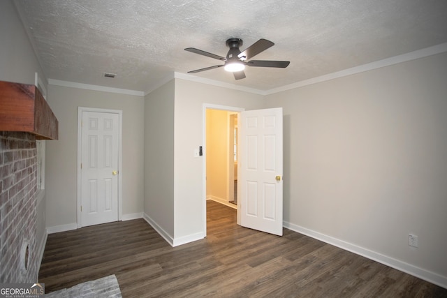 235 Cindy St, Jackson, GA 30233 - unfurnished bedroom featuring dark wood-style floors, a textured ceiling, crown molding, and ceiling fan