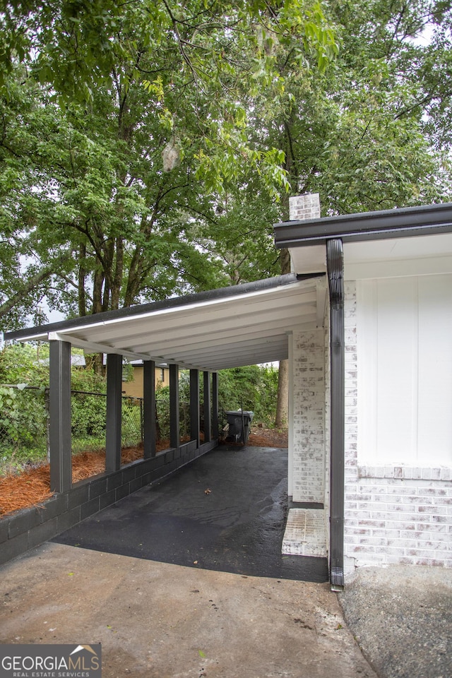 235 Cindy St, Jackson, GA 30233 - view of parking / parking lot featuring concrete driveway and an attached carport