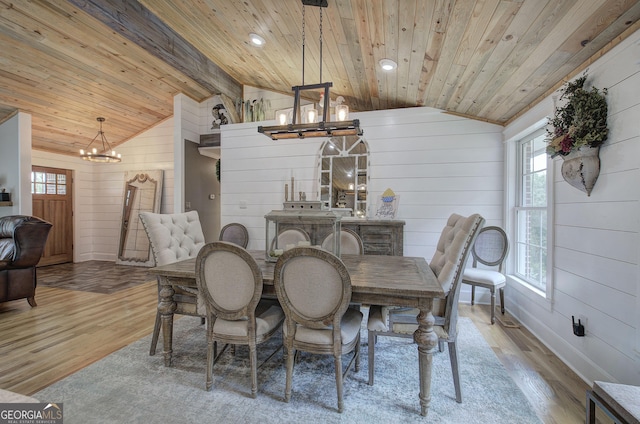 198 Hillcrest Dr, Calhoun, GA 30701 - dining space with a chandelier, wood finished floors, wooden ceiling, wood walls, and plenty of natural light
