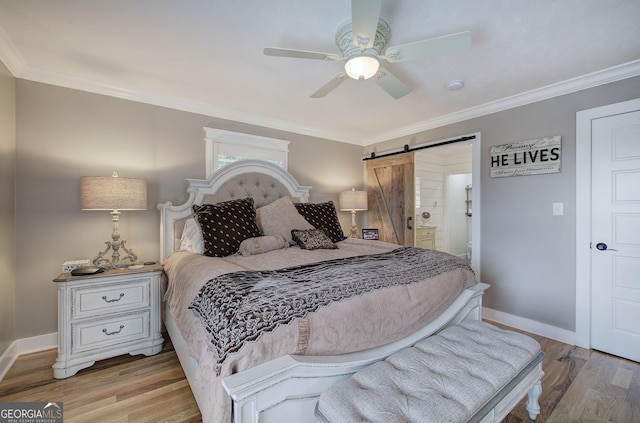 198 Hillcrest Dr, Calhoun, GA 30701 - bedroom featuring a barn door, wood finished floors, crown molding, a ceiling fan, and ensuite bathroom