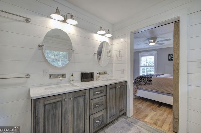 198 Hillcrest Dr, Calhoun, GA 30701 - full bath with double vanity, wood finished floors, ensuite bath, a ceiling fan, and ornamental molding