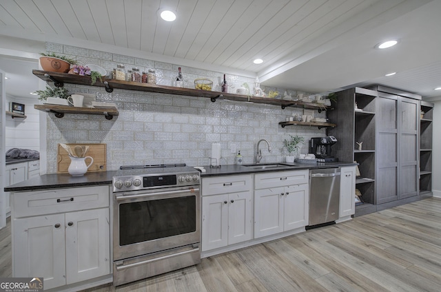 198 Hillcrest Dr, Calhoun, GA 30701 - kitchen with stainless steel appliances, open shelves, dark countertops, white cabinets, and recessed lighting
