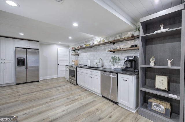 198 Hillcrest Dr, Calhoun, GA 30701 - kitchen with appliances with stainless steel finishes, open shelves, tasteful backsplash, dark countertops, and white cabinets