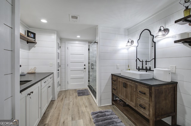 198 Hillcrest Dr, Calhoun, GA 30701 - full bath featuring vanity, wood finished floors, a stall shower, and recessed lighting