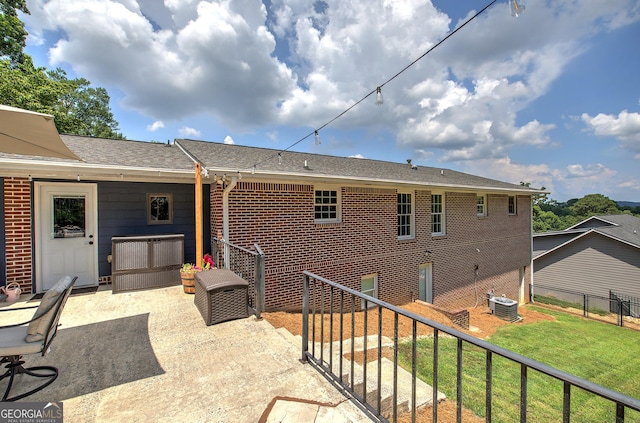 198 Hillcrest Dr, Calhoun, GA 30701 - back of house with brick siding, a patio, and roof with shingles