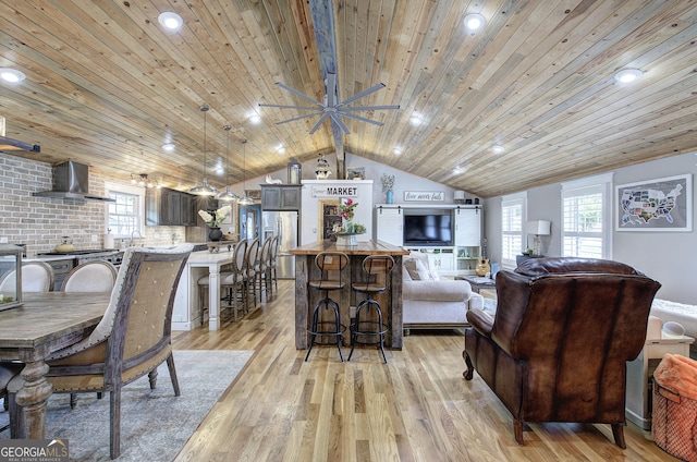 198 Hillcrest Dr, Calhoun, GA 30701 - living area with vaulted ceiling, wood ceiling, light wood-type flooring, and plenty of natural light