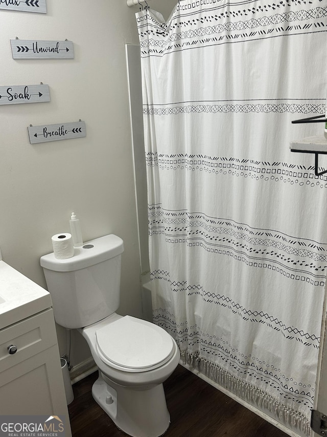 3332 Waldrop Trl, Decatur, GA 30034 - bathroom with wood finished floors, vanity, and shower / bath combo with shower curtain
