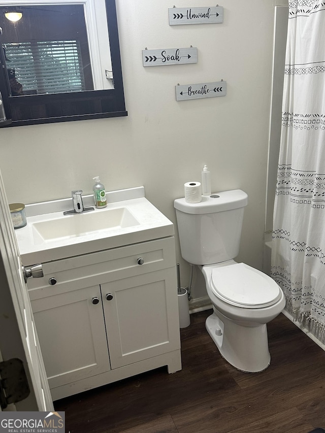 3332 Waldrop Trl, Decatur, GA 30034 - bathroom featuring vanity, wood finished floors, and a shower with shower curtain