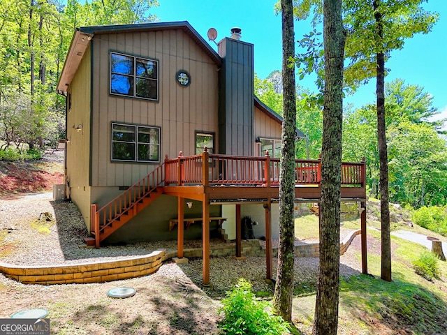 967 Saddle Gap Dr, Clayton, GA 30525 - view of front of house featuring a wooden deck, stairs, and a chimney