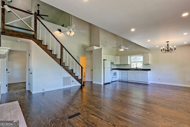 967 Saddle Gap Dr, Clayton, GA 30525 - unfurnished living room featuring dark wood finished floors, a ceiling fan, a chandelier, high vaulted ceiling, and recessed lighting