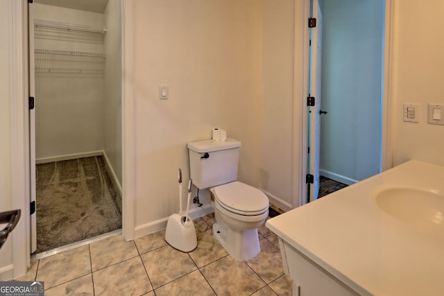 967 Saddle Gap Dr, Clayton, GA 30525 - bathroom featuring a spacious closet, tile patterned floors, and vanity