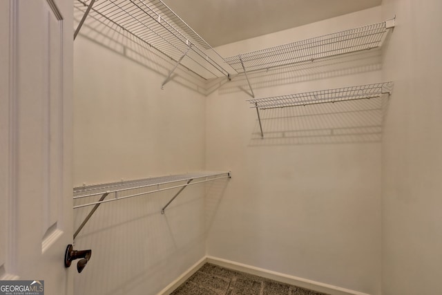 967 Saddle Gap Dr, Clayton, GA 30525 - walk in closet with dark carpet