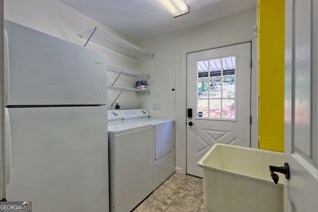 967 Saddle Gap Dr, Clayton, GA 30525 - laundry area with washing machine and clothes dryer and light tile patterned floors