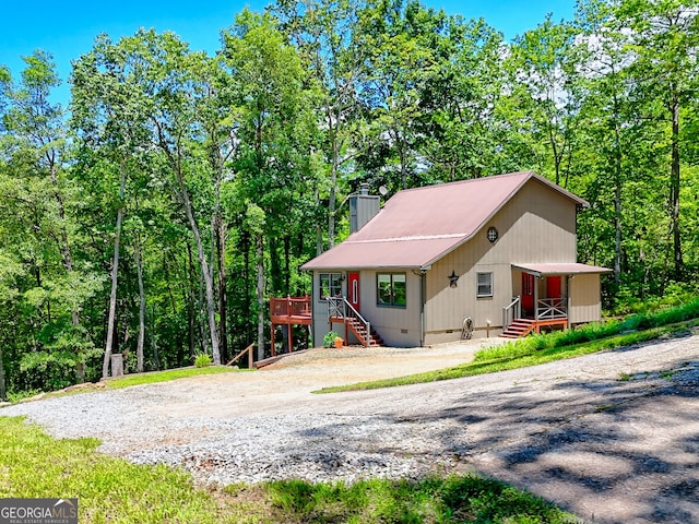 967 Saddle Gap Dr, Clayton, GA 30525 - view of front facade featuring a chimney, a wooden deck, crawl space, and entry steps