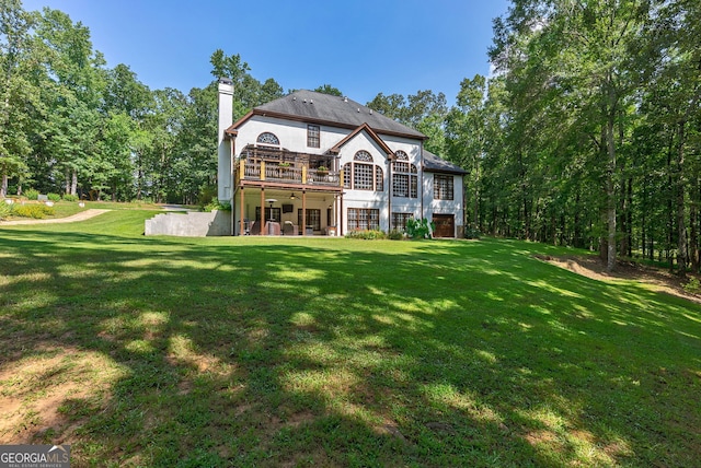 1770 Whippoorwill Rd, Watkinsville, GA 30677 - back of house with a chimney, a lawn, and a patio area