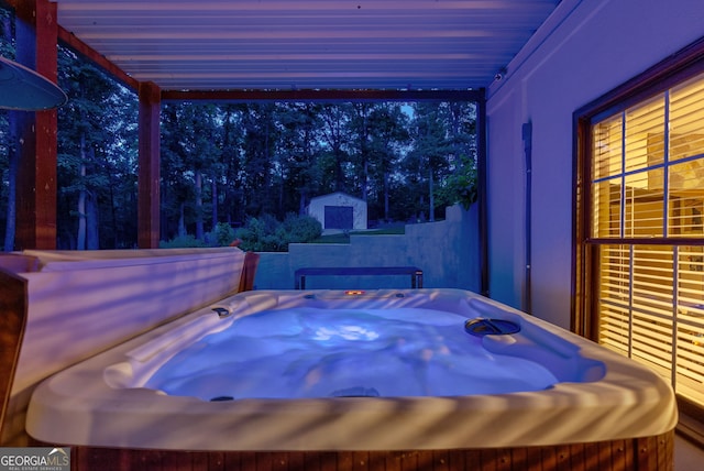 1770 Whippoorwill Rd, Watkinsville, GA 30677 - view of patio featuring a hot tub and a storage shed