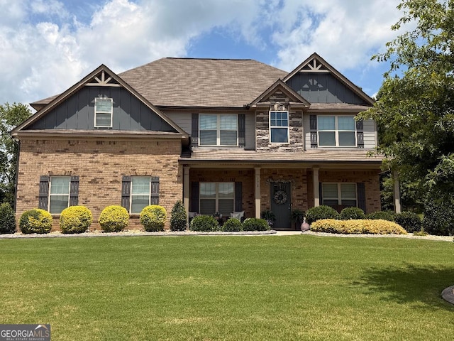 173 Lavender Way, Mcdonough, GA 30252 - craftsman-style house featuring a front yard, brick siding, and board and batten siding