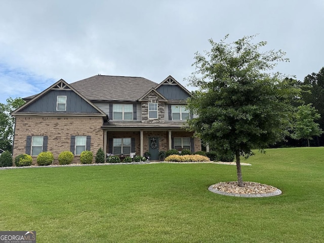 173 Lavender Way, Mcdonough, GA 30252 - craftsman-style house featuring a front yard, board and batten siding, and brick siding