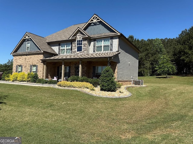 173 Lavender Way, Mcdonough, GA 30252 - craftsman-style house with a front yard, a porch, brick siding, and board and batten siding