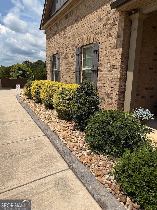 173 Lavender Way, Mcdonough, GA 30252 - view of side of home featuring brick siding