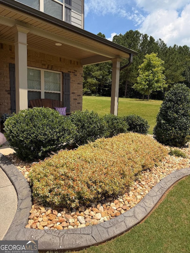 173 Lavender Way, Mcdonough, GA 30252 - view of green lawn with covered porch
