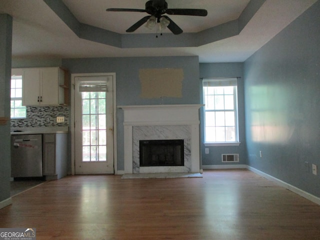 181 Thorpe Rd, Jackson, GA 30233 - unfurnished living room with light wood-type flooring, a ceiling fan, and healthy amount of natural light