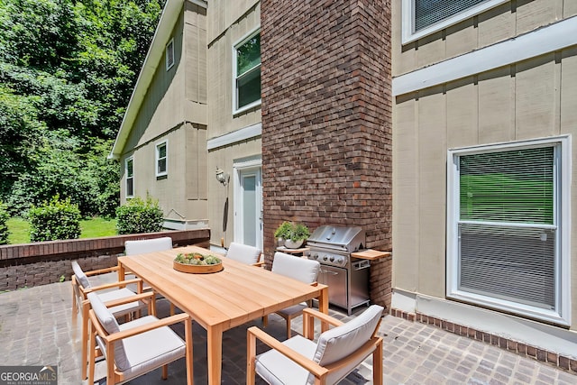 717 Raven Springs Trl, Stone Mountain, GA 30087 - view of patio featuring outdoor dining space and a grill