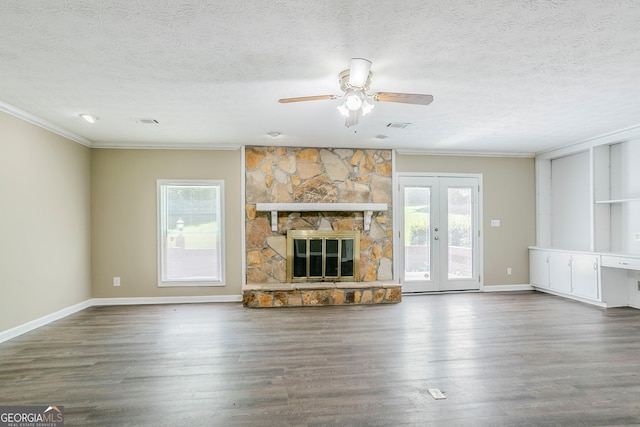 717 Raven Springs Trl, Stone Mountain, GA 30087 - unfurnished living room with ornamental molding, plenty of natural light, wood finished floors, a textured ceiling, and ceiling fan