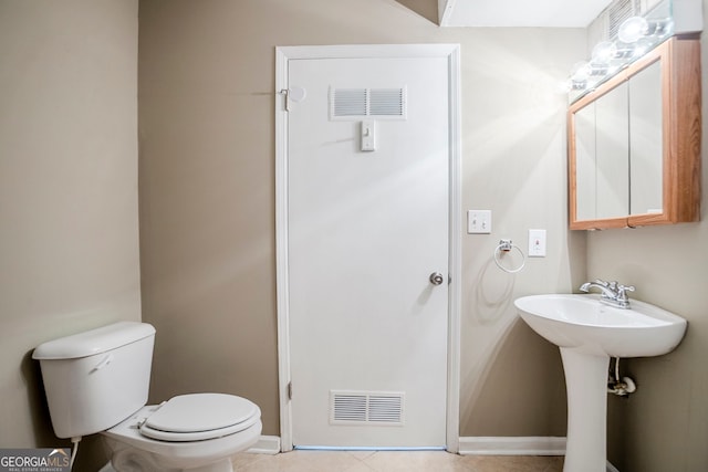 717 Raven Springs Trl, Stone Mountain, GA 30087 - bathroom with toilet and tile patterned floors