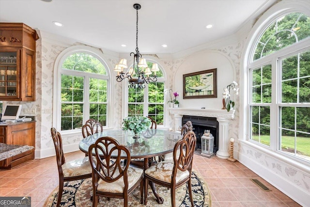 311 N Rivoli Farms Dr, Macon, GA 31210 - dining room featuring wallpapered walls, a chandelier, light tile patterned flooring, ornamental molding, and recessed lighting